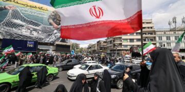After Trump pauses war, Iranians fly flags of victory, not surrender
