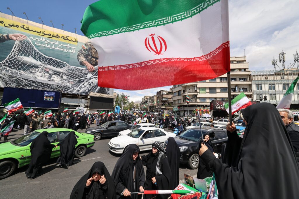 After Trump pauses war, Iranians fly flags of victory, not surrender