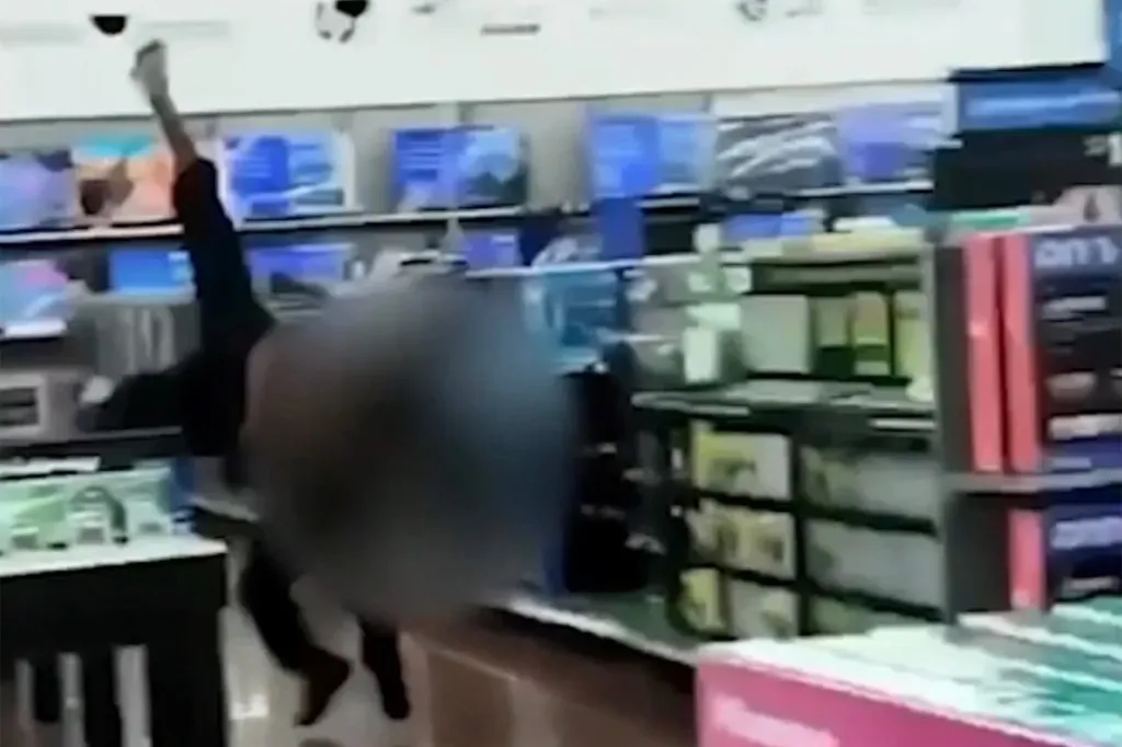 The 20-second distressing clip showed the officer holding the man's arms behind his back in the electronics section, exchanging words briefly before grabbing him around the chest, hoisting him into the air and slamming him to the ground.