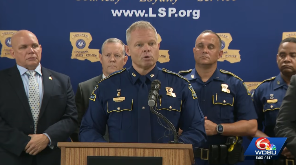 Louisiana State Police officers at a press conference.