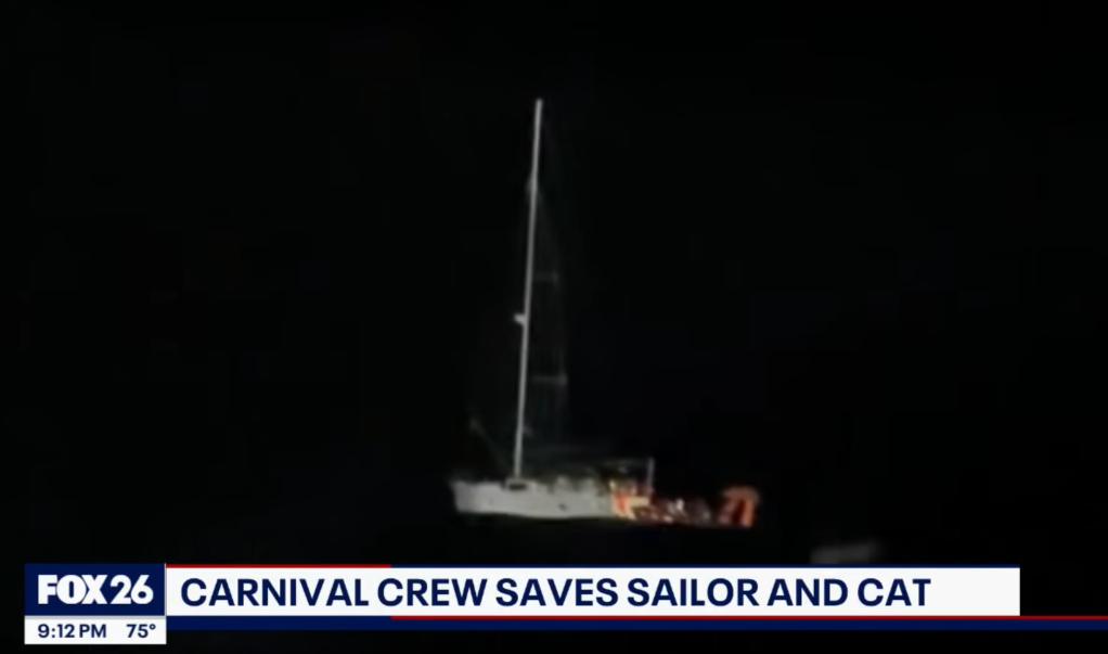 A passenger aboard a disabled sailboat drifting in the Caribbean waters is rescued by crews aboard the Carnival Legend on April 14, 2026.