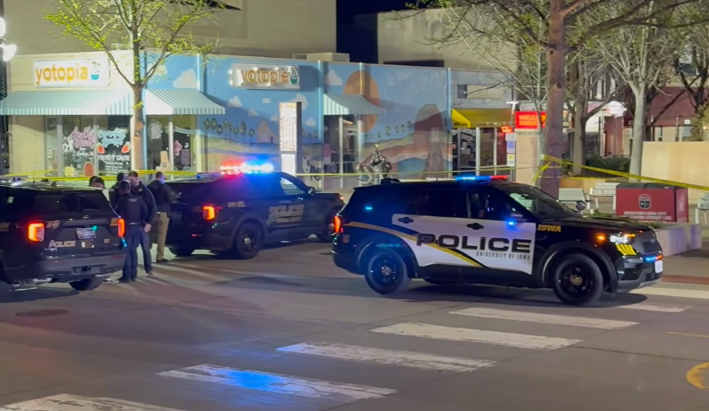 Police set up a crime scene investigation in Iowa City after a shooting broke out on April 19, 2026.