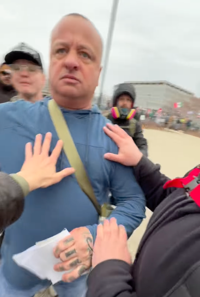 Chris Ostroushko was captured on video violently shoving Turning Point USA reporter Savanah Hernandez during an anti-ICE protest in Minnesota.