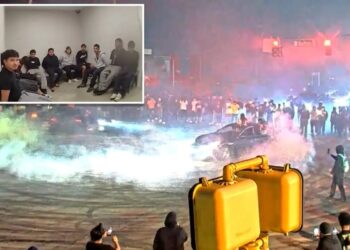 Over 200 swarm Atlanta intersection in illegal street takeover roaring with cars racing and doing donuts