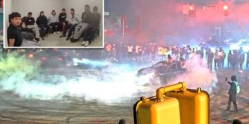 Over 200 swarm Atlanta intersection in illegal street takeover roaring with cars racing and doing donuts