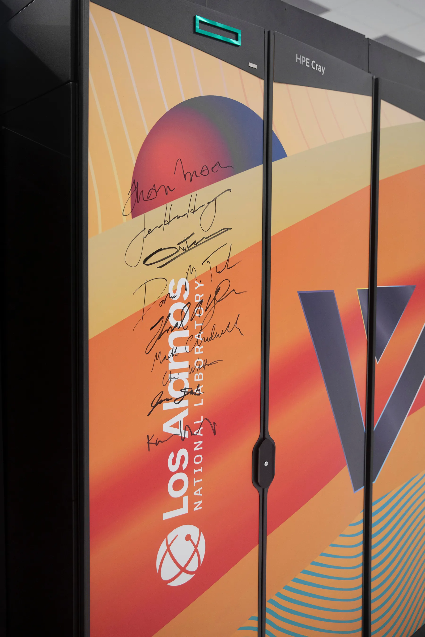 signatures seen on the exterier of a bright orange supercomputer