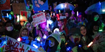 Japan is a pacifist nation, and now a hint of change is drawing rare protests