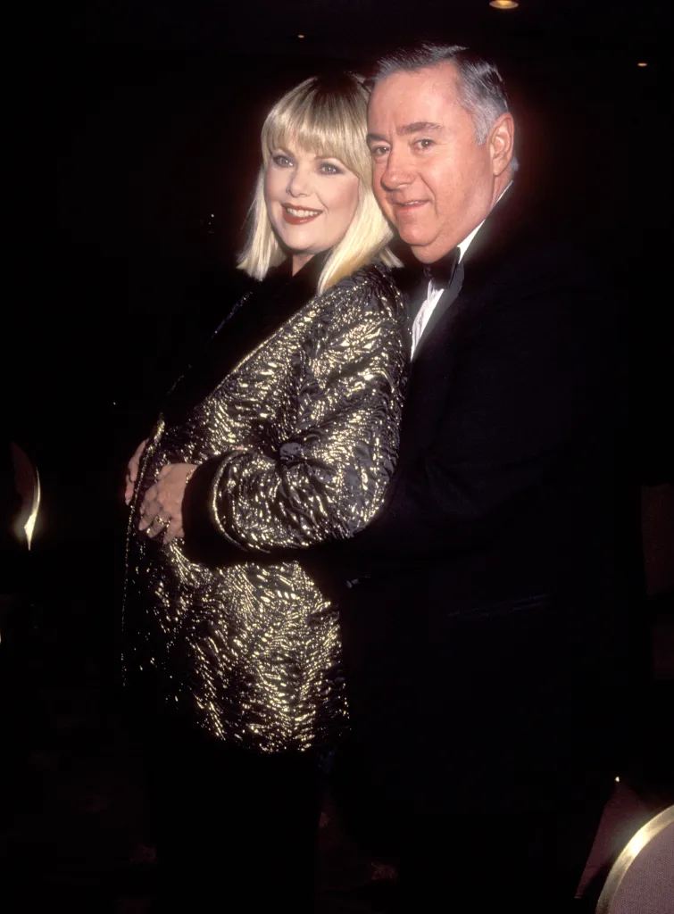 Actress Ann Jillian, pregnant and in a shimmering gold and black dress, with husband Andy Murcia in a tuxedo, at a gala.