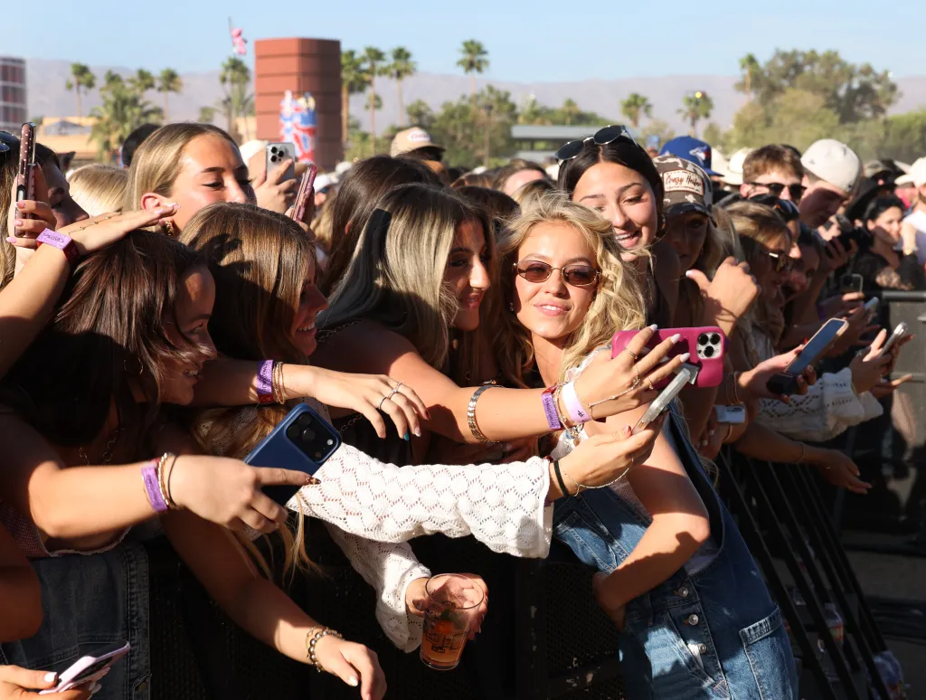 Actress Sydney Sweeney taking photos with fans at the Stagecoach Country Music Festival.