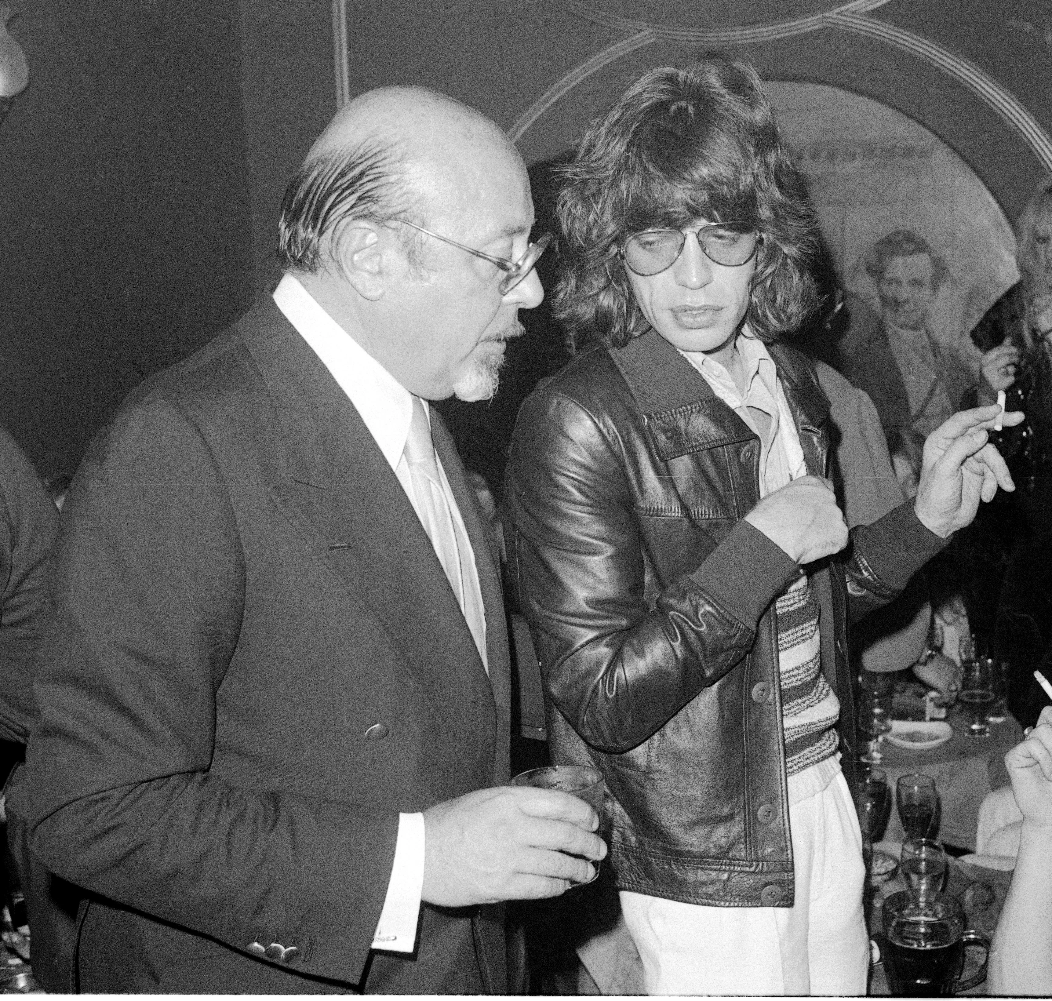 Ahmet Ertegun, head of Atlantic Records, talks to Mick Jagger.