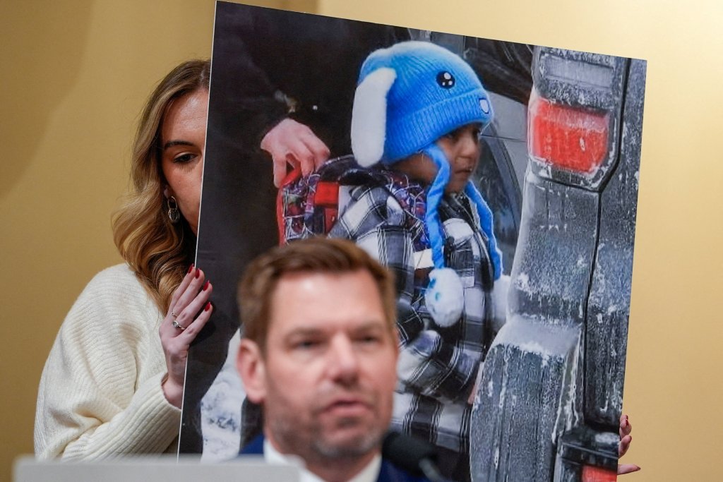 An aide holds up an image of 5-year-old Liam Conejo Ramos during a U.S. House Homeland Security Committee hearing.