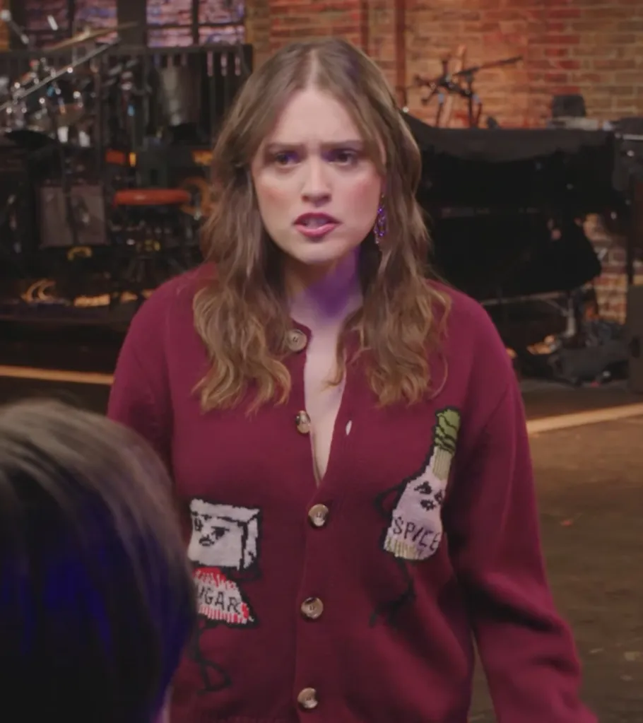 Aimee Lou Wood wearing a maroon cardigan with 