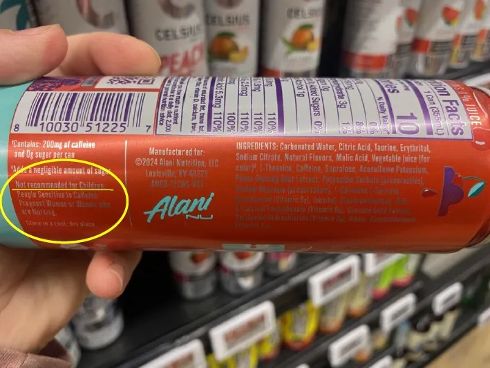 The warning label on the back of an Alani Nu can advising children not to consume the beverage.