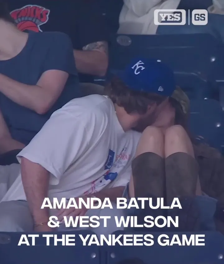 Amanda Batula and West Wilson kissing at the Yankees game.