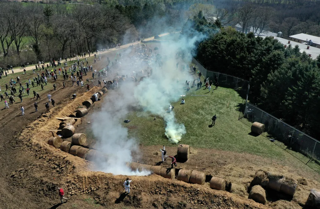Aerial view of animal rights activists reacting to tear gas during a protest.