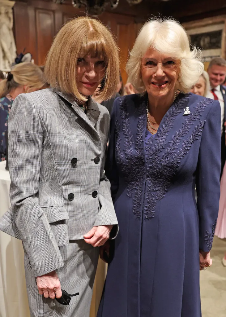 Anna Wintour, in a grey check skirt suit, and Queen Camilla, in a navy blue dress, attend a literary engagement at New York Public Library.