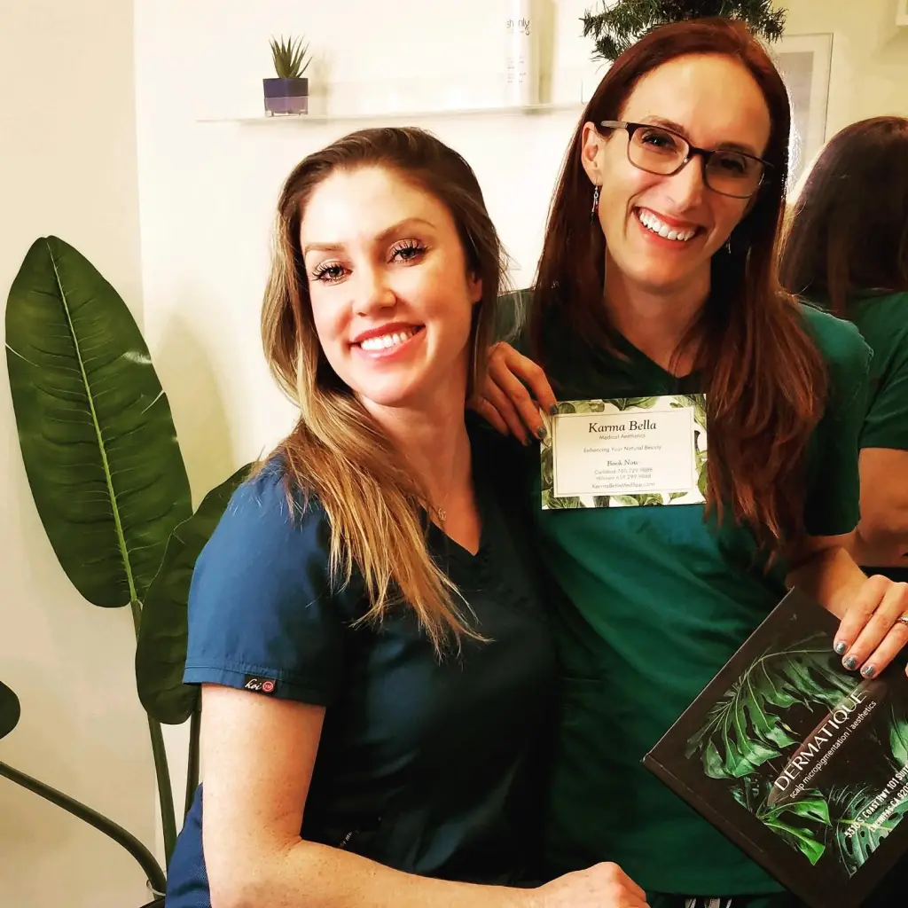 Arianna Dillman smiling with a colleague.