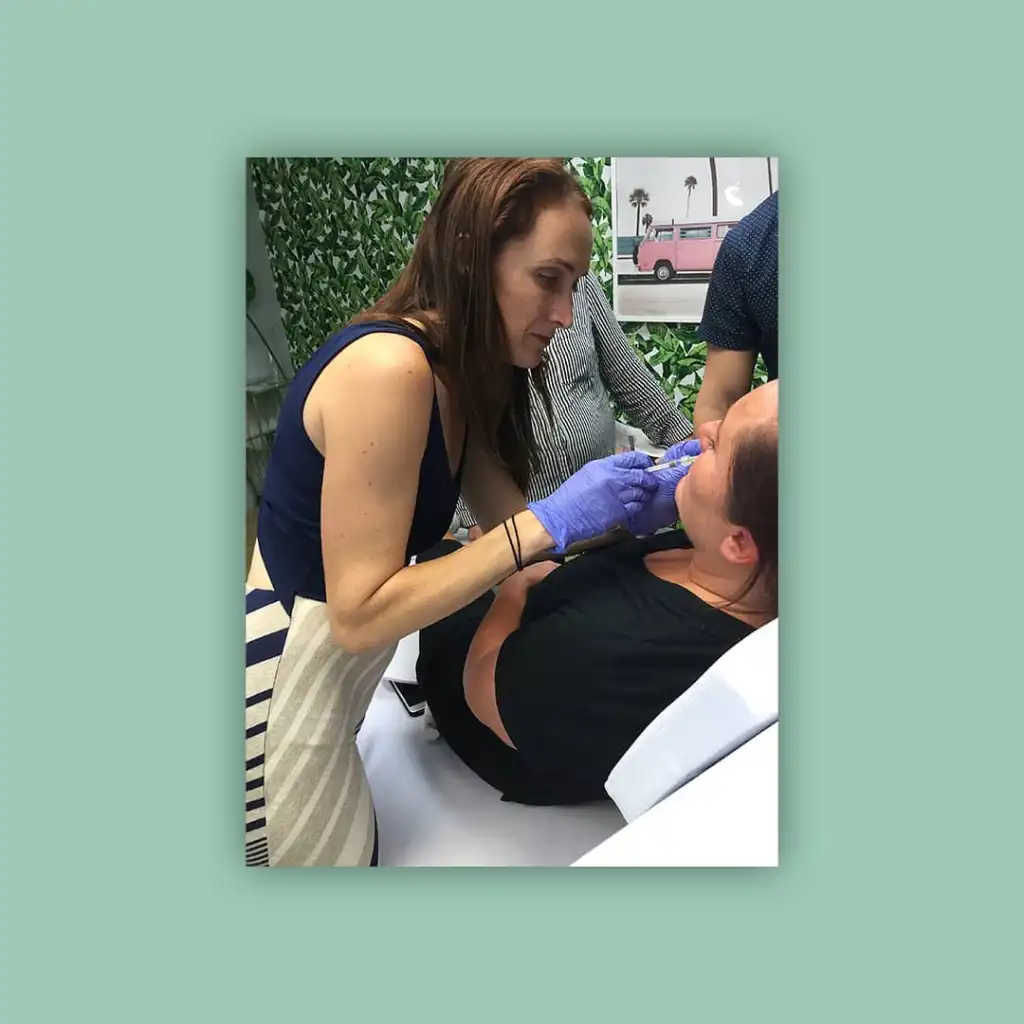 Arianna Dillman, a top ER doctor, administering an injection to a patient.