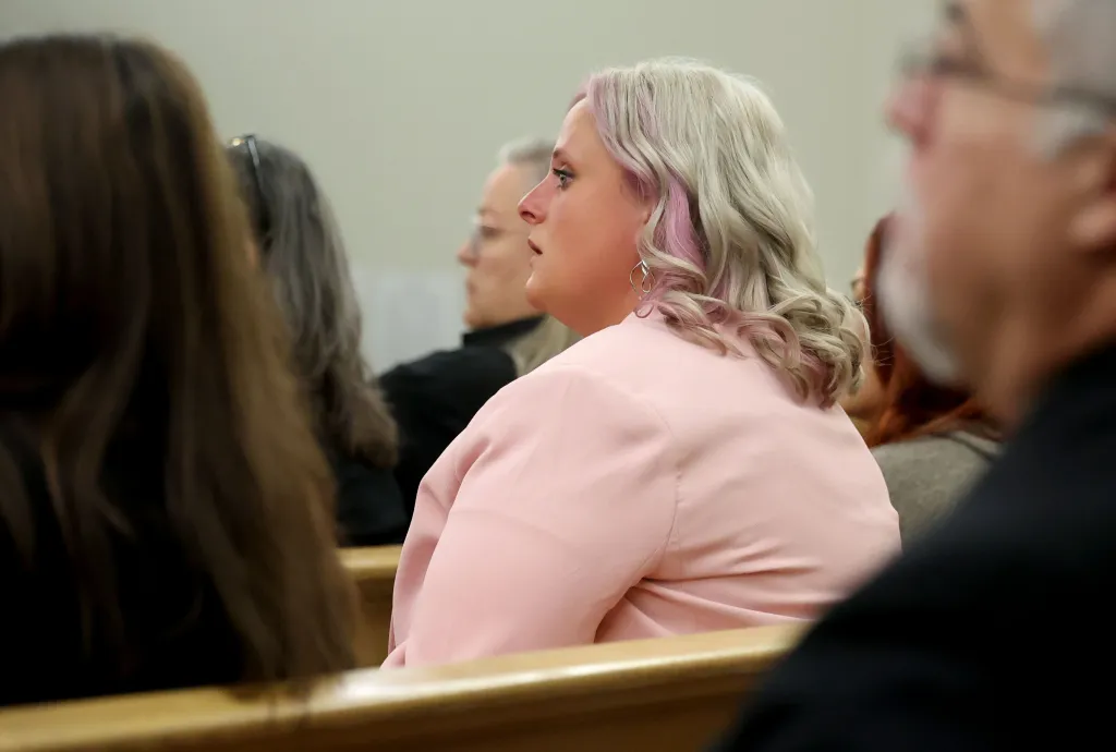 Gandy seen in court in a pink sweater. 