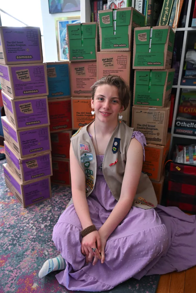 Ashleigh with boxes of cookies.