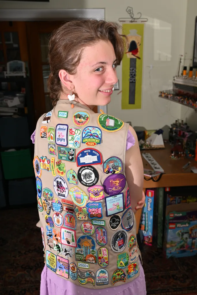 Ashleigh shows off her badges.