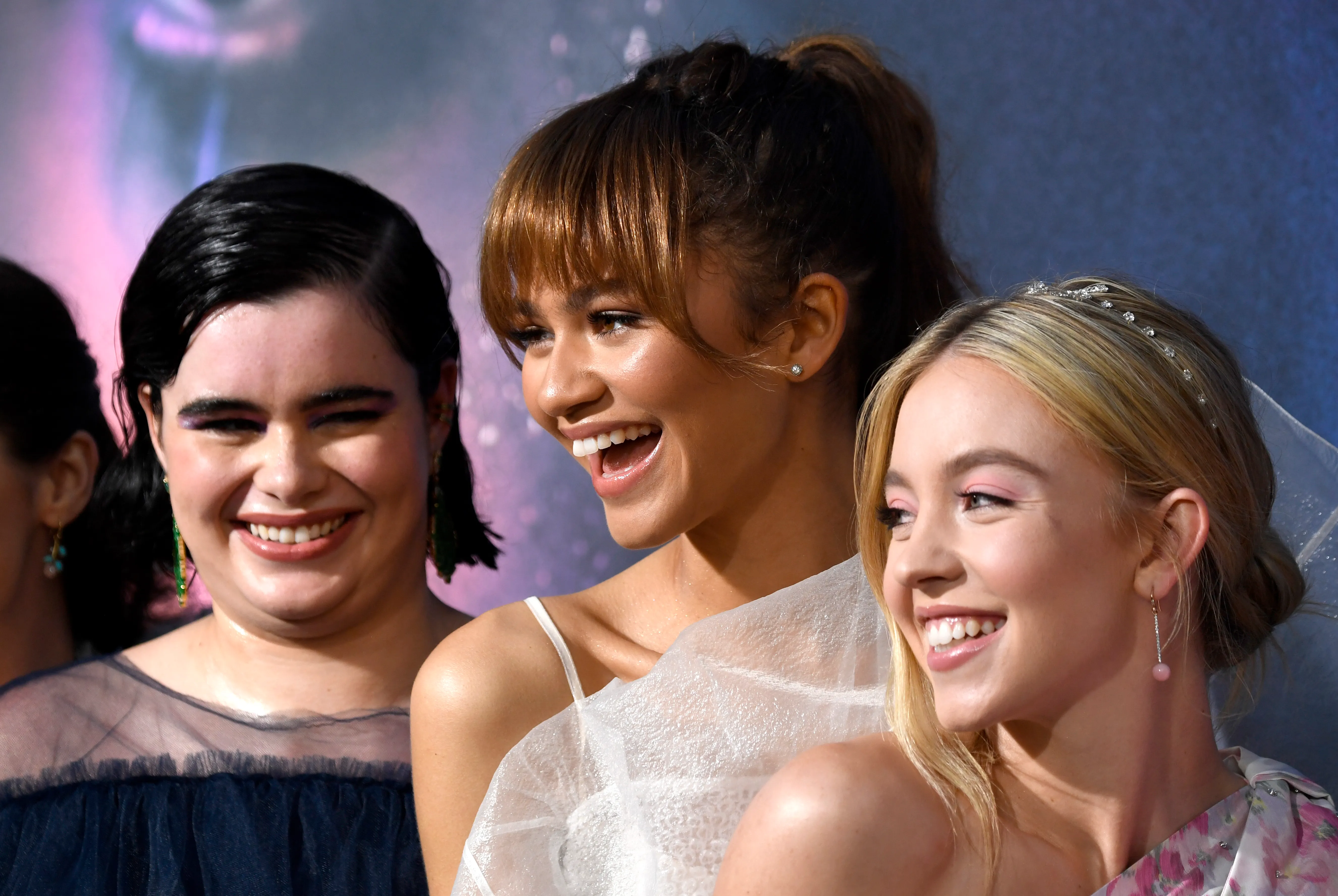 Barbie Ferreira, Zendaya, and Sydney Sweeney smiling at the Euphoria premiere.