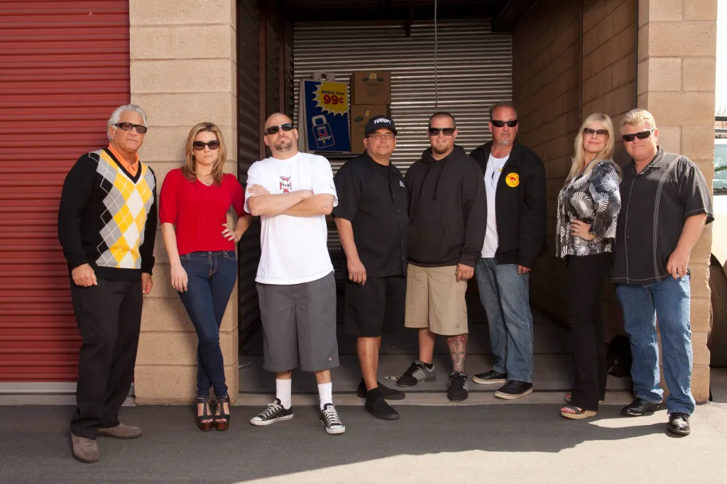 Cast shot of Barry Weiss, Brandi Passante, Jarrod Schulz, Dave Hester, Brandon Sheets, Darrell Sheets, Laura Dotson, and Dan Dotson from Storage Wars, Season 3.