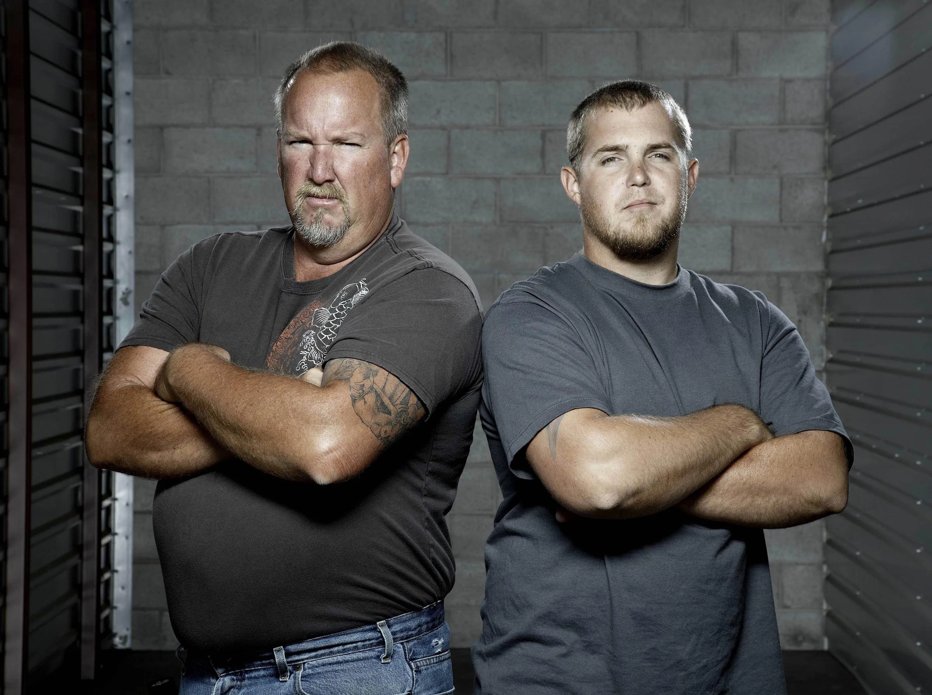 Darrell Sheets and Brandon Sheets from Storage Wars with arms crossed.