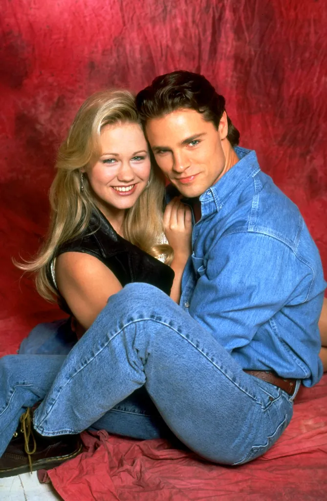 Maitland Ward and Dylan Neal from the TV show The Bold and the Beautiful, sitting close together and smiling.