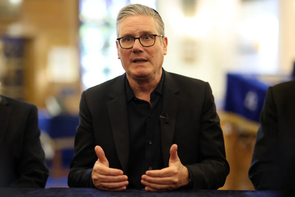 Britain's Prime Minister Keir Starmer talks during a visit to Kenton United Synagogue.
