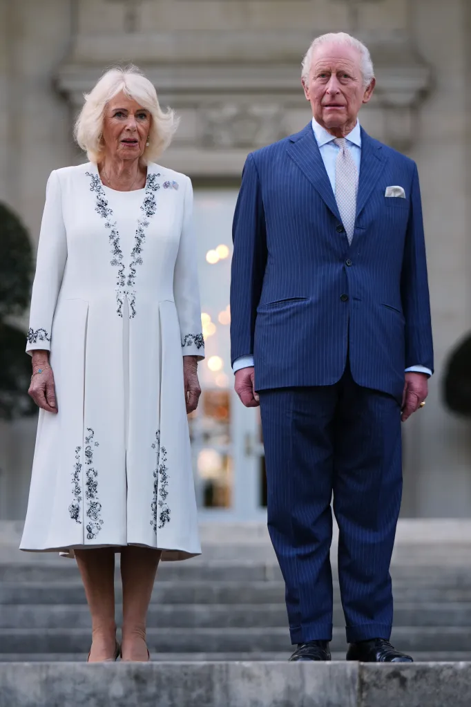 Queen Camilla and King Charles III posing for a photo.