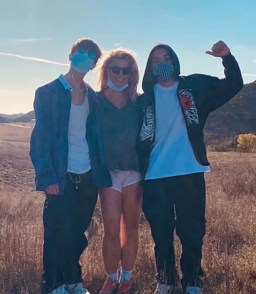 Britney Spears with her sons, Jayden and Preston Federline, wearing masks outdoors.