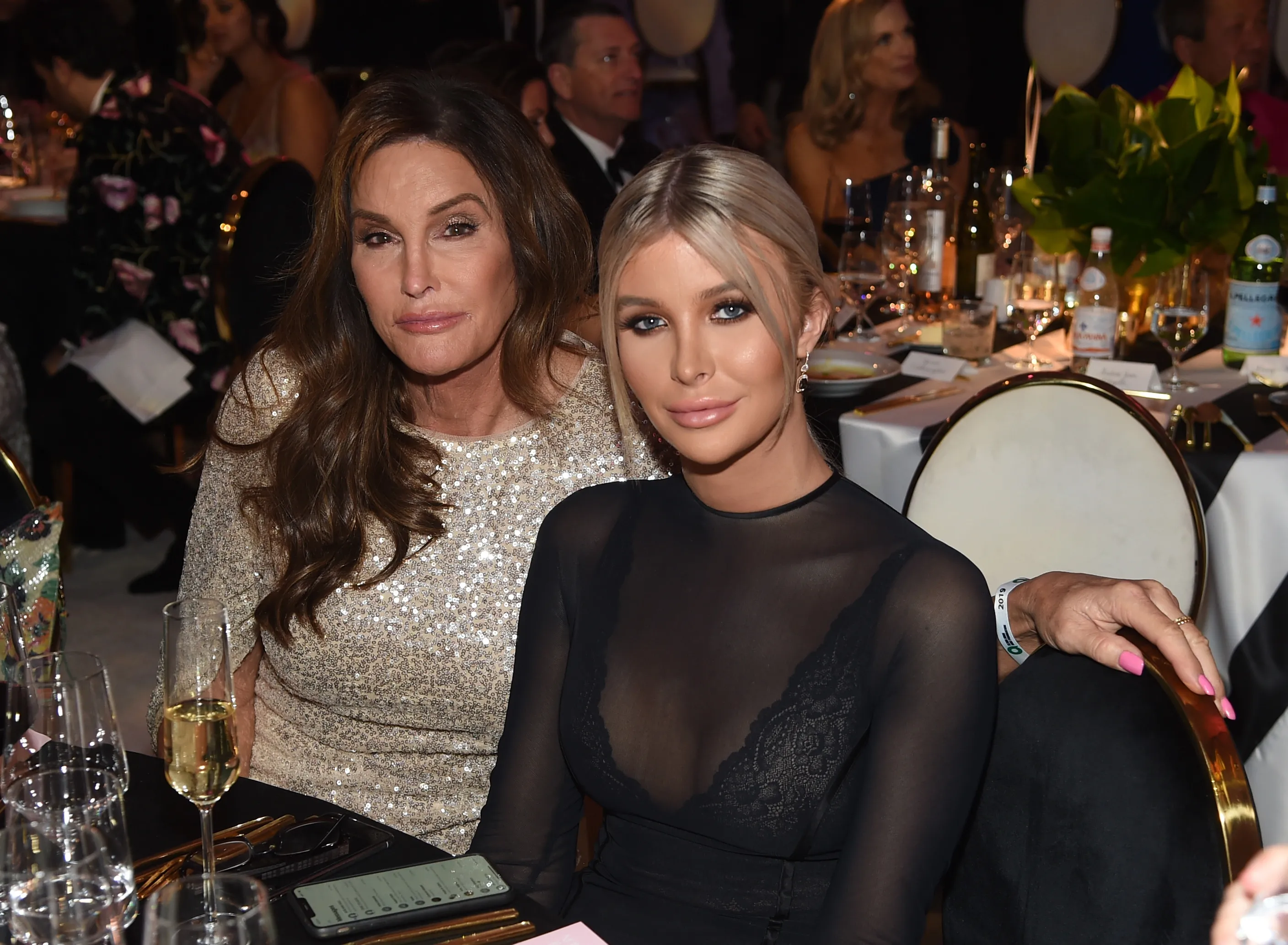 Caitlyn Jenner and Sophia Hutchins attend an Academy Awards viewing party.
