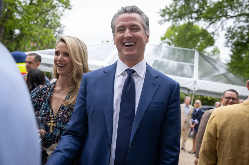 Gavin Newsom smiling at the 33rd Annual White House Correspondents' Garden Brunch.