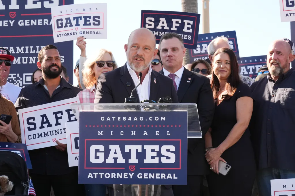 Steve Hilton speaks at a podium to announce Michael Gates' candidacy for California Attorney General.