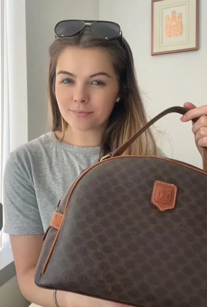 Charlee Roundhill holding a vintage designer bag.