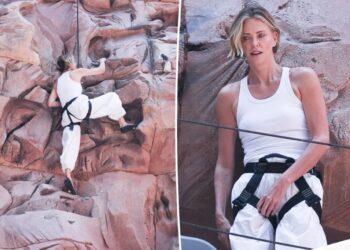 Charlize Theron takes ‘Apex’ promo to new heights with wall-climbing stunt in NYC