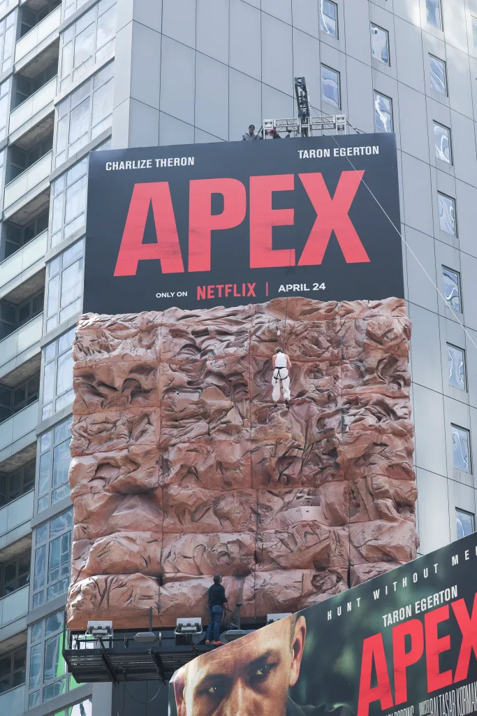 Charlize Theron is seen after climbing a wall to promote her new Netflix movie 