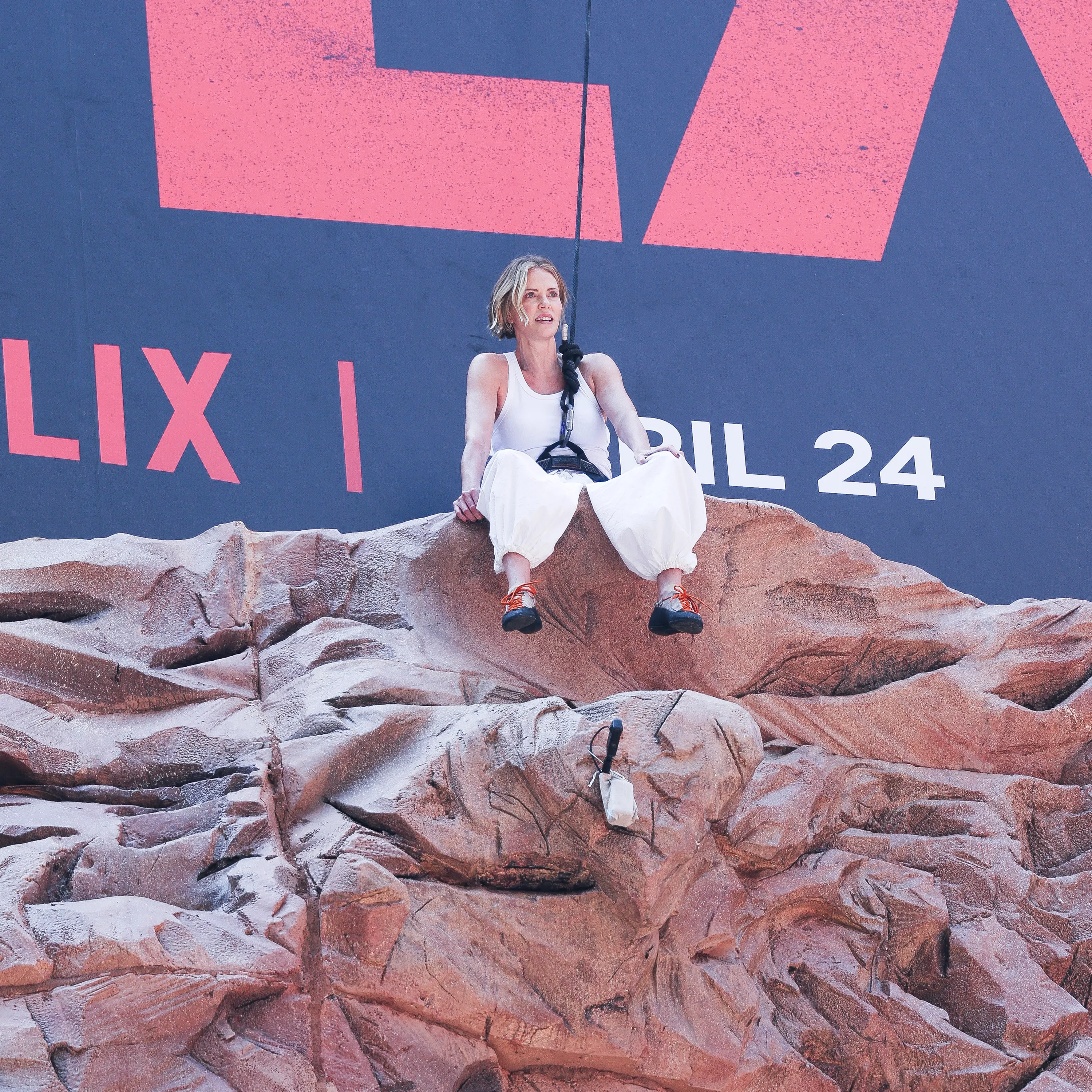 Charlize Theron is seen after climbing a wall to promote her new Netflix movie 