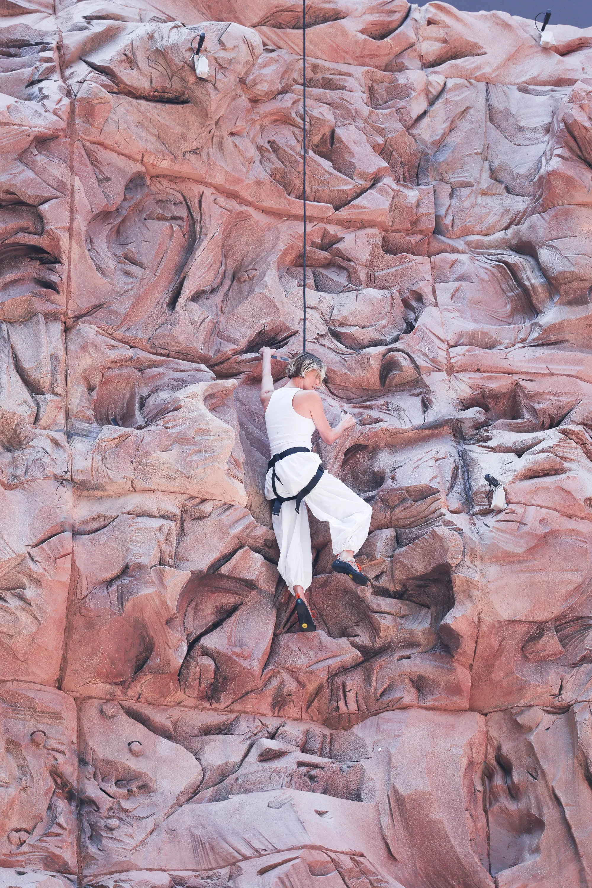 Charlize Theron is seen after climbing a wall to promote her new Netflix movie 
