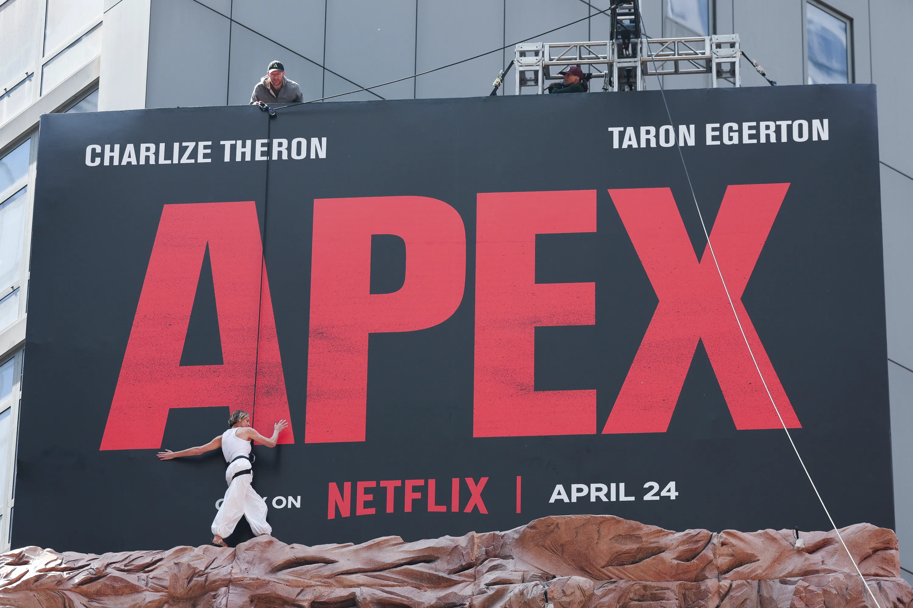 Charlize Theron is seen after climbing a wall to promote her new Netflix movie 