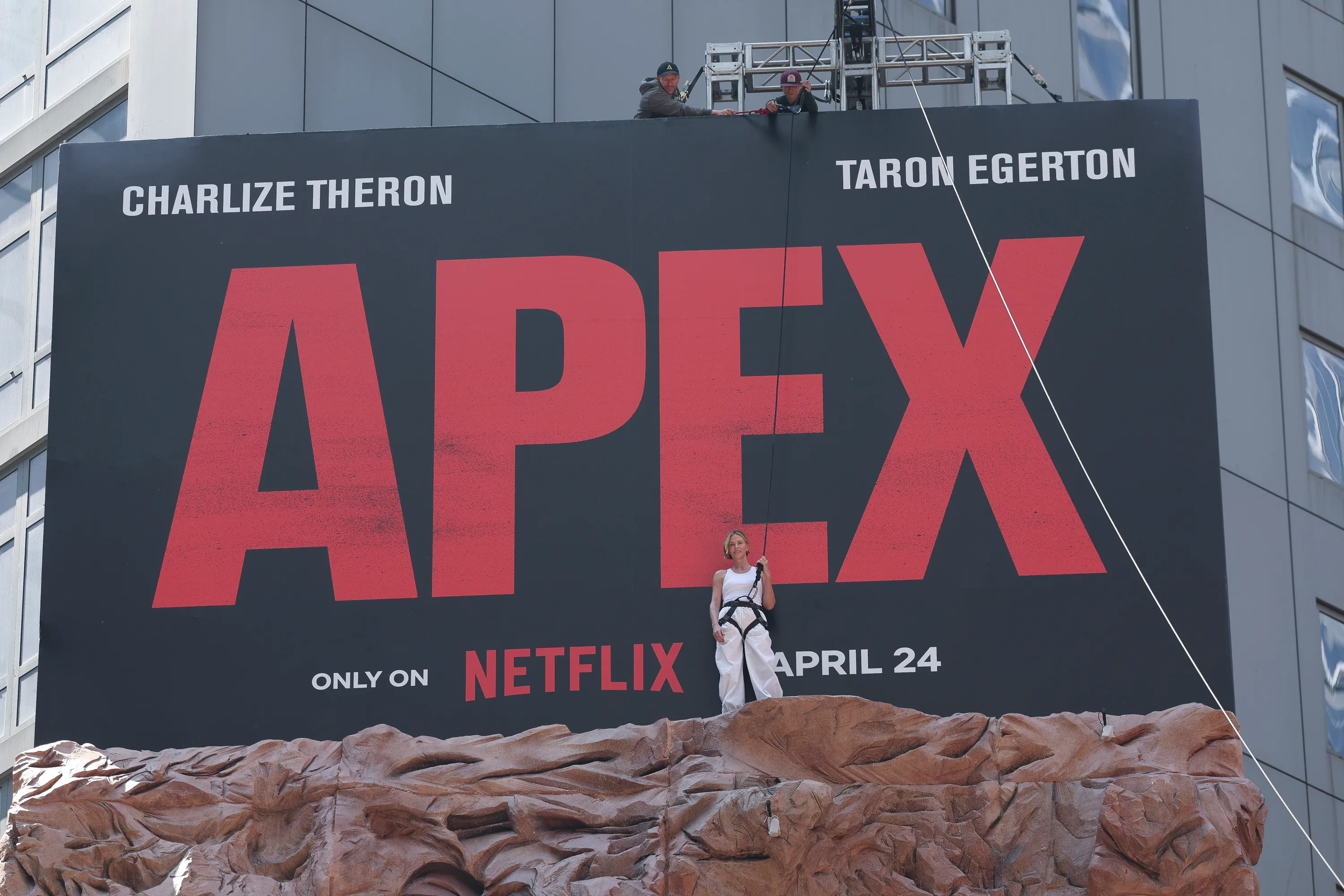 Charlize Theron is seen after climbing a wall to promote her new Netflix movie 