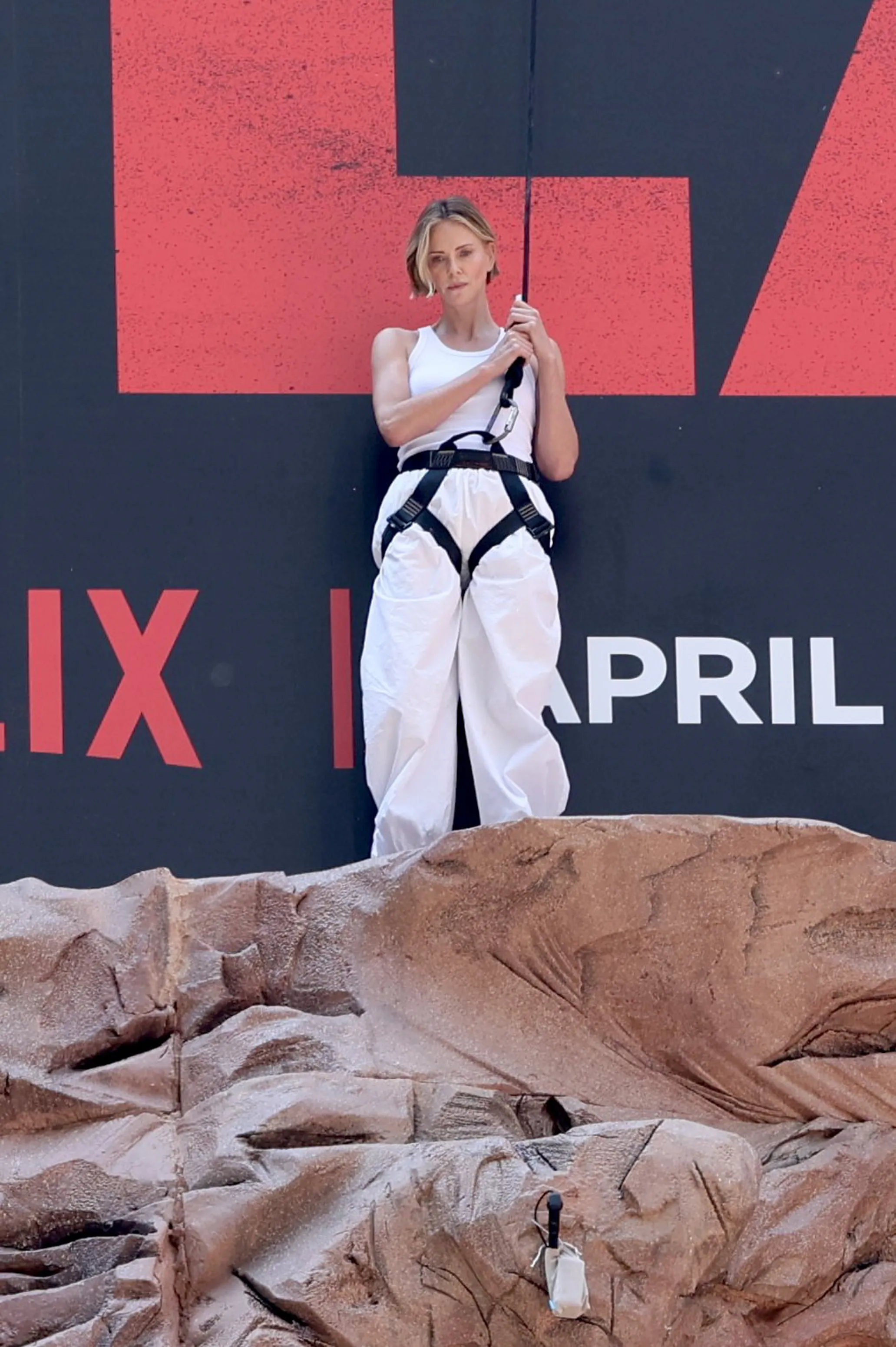Charlize Theron is seen after climbing a wall to promote her new Netflix movie 