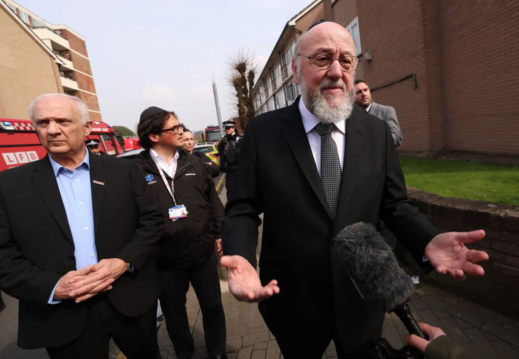 Chief Rabbi Ephraim Mirvis speaks to reporters after an antisemitic arson attack on a Jewish ambulance service.