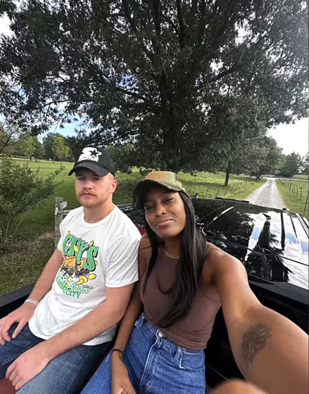 Ciara Miller and West Wilson of Summer House in a car, with a dirt road and trees in the background.