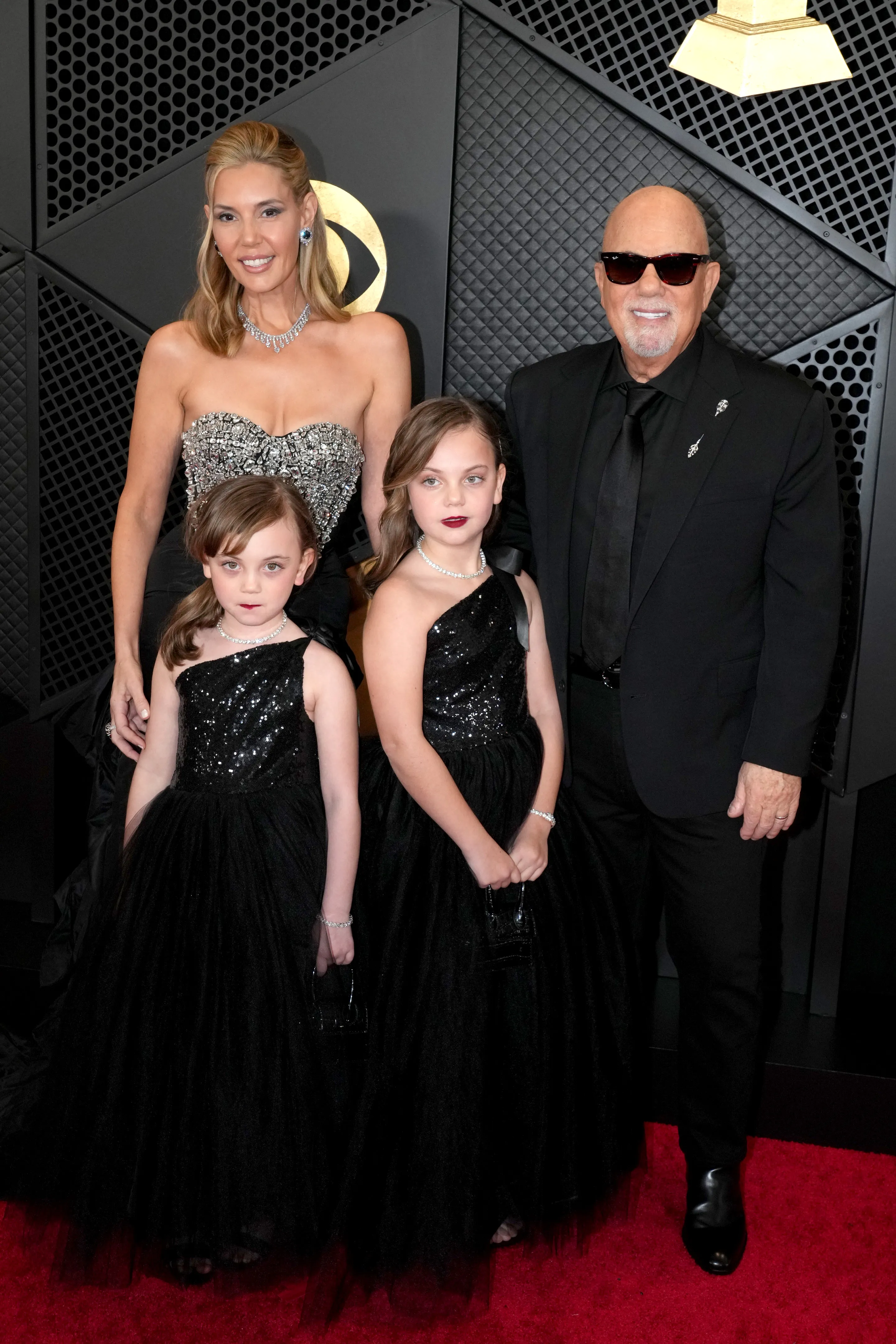 Billy Joel with his wife, Alexis Roderick, and daughters Della and Remy at the 66th GRAMMY Awards.