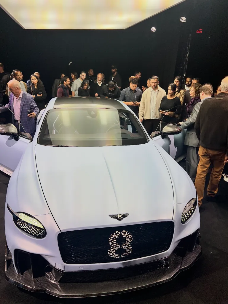 A light blue Bentley car with an