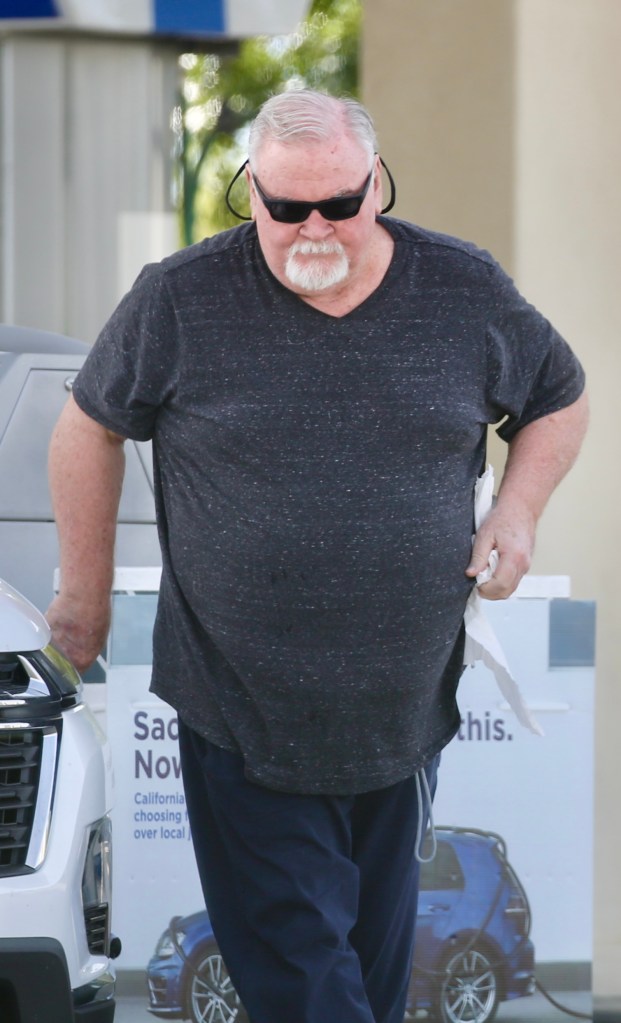 Crist Marvin cleaning his windshield at a McDonald's drive-through.