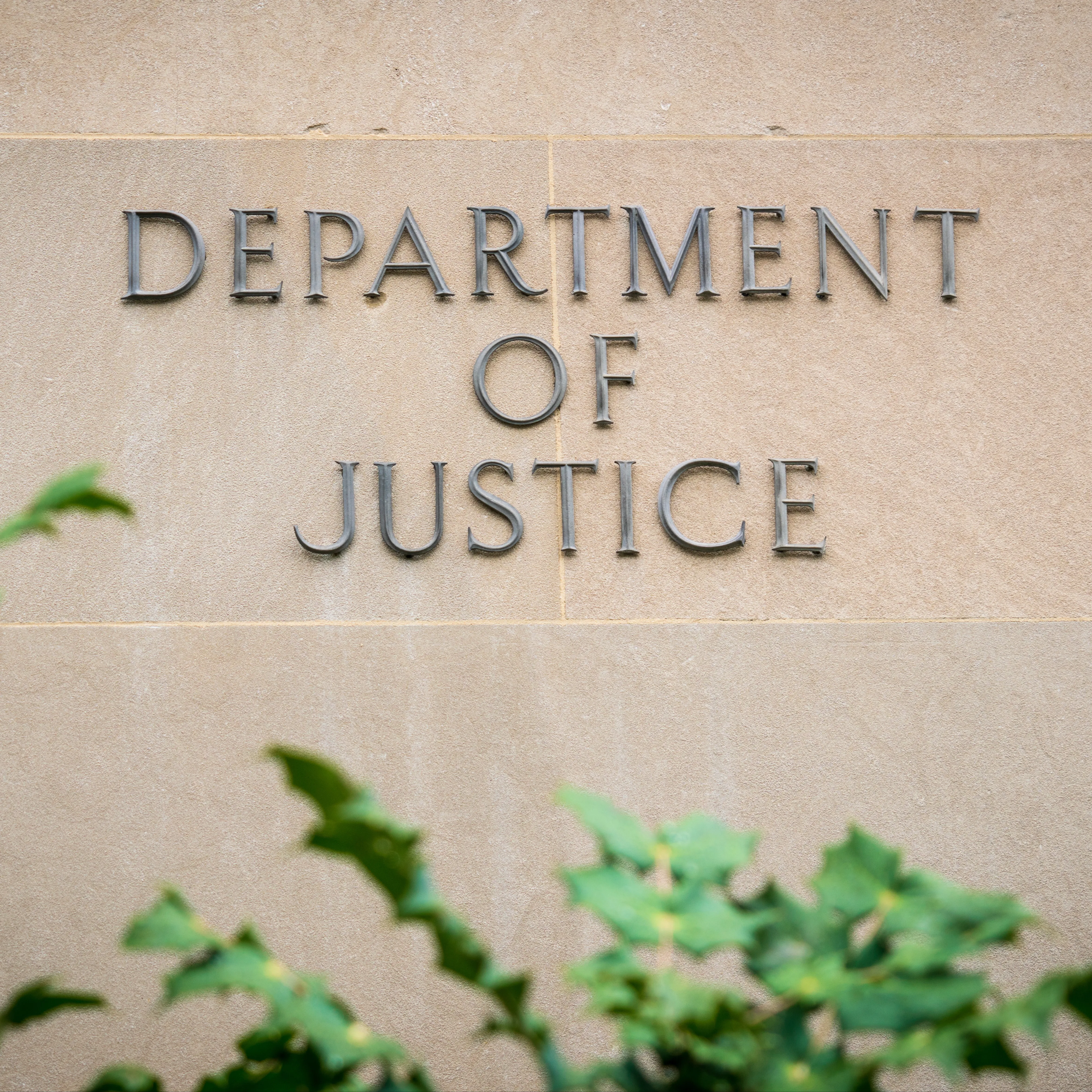 Sign for the Department of Justice on a building in Washington D.C.
