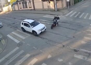 Horrific moment motorcycle smashes into car, killing rider and seriously wounding passenger
